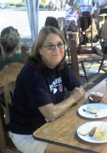 Mary enjoying a burger and chips