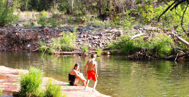 Cool water, warm day. Jenny and Zach enjoy the creek.