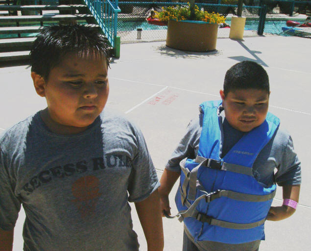 Chris and his cousin, Peter, with a life vest.