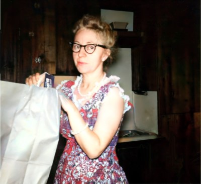 Mom, ready to load her weather-pine cabinets.