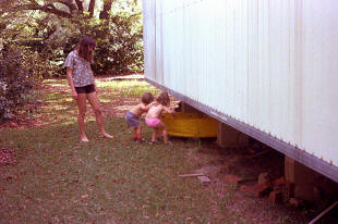 Pool stored under the mobile home.