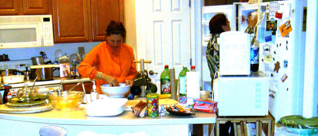 Cleanup: Karen and Mary packaging leftovers.