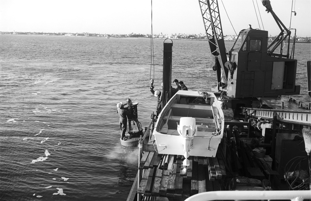 Returning the buoy to the sea.