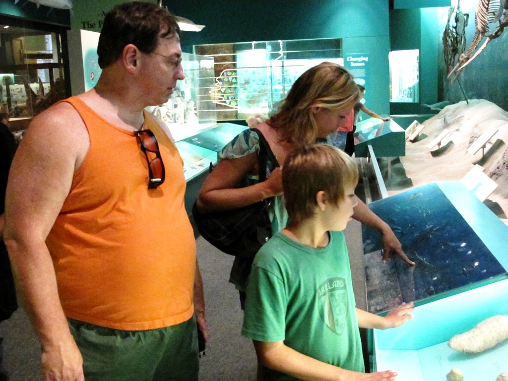 Michael, Karen and Zach check out an exhibit.