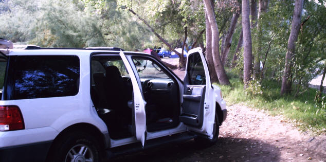 My car before I set up the tent, showing a few neighboring tents already set up.
