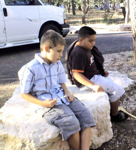 The boys await breakfast.