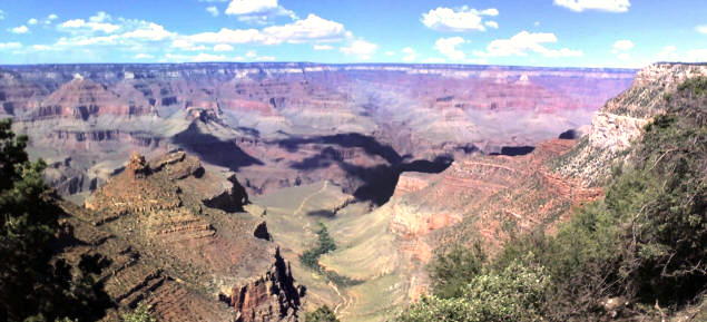 Cloud shadows dapple the canyon.