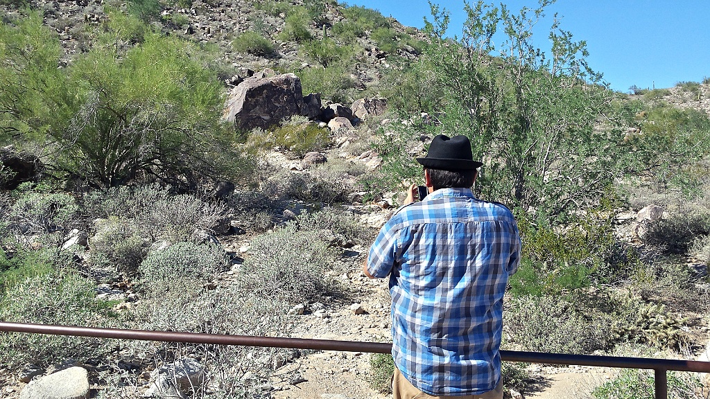 Keith photographing White Tank Mountain Regional Park petroglyphs